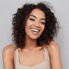 portrait-of-a-happy-young-african-woman-XCUHNJQ.jpg